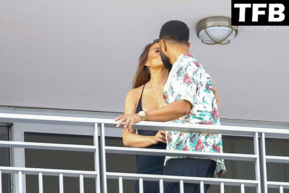 Chrissy Teigen & John Legend Kiss and Pose During an Impromptu Balcony Shoot - #16