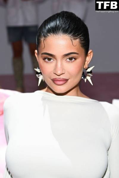 Kylie Jenner Flaunts Her Curves in a White Dress During Paris Fashion Week on solefans.net