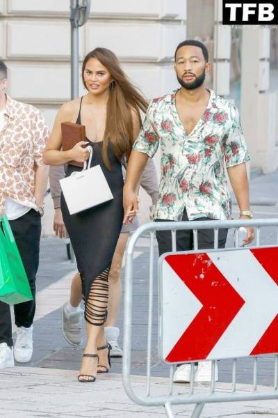 Chrissy Teigen Goes Braless Under a Very Sexy Sheer Black Dress in France - France on solefans.net