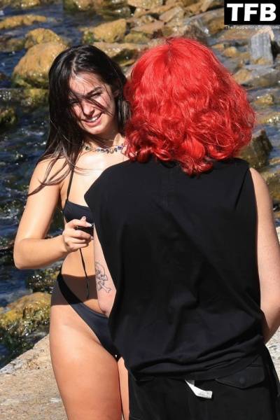 Addison Rae Displays Her Curves in a Black Bikini on Holiday with Omer Fedi on Lake Como on solefans.net